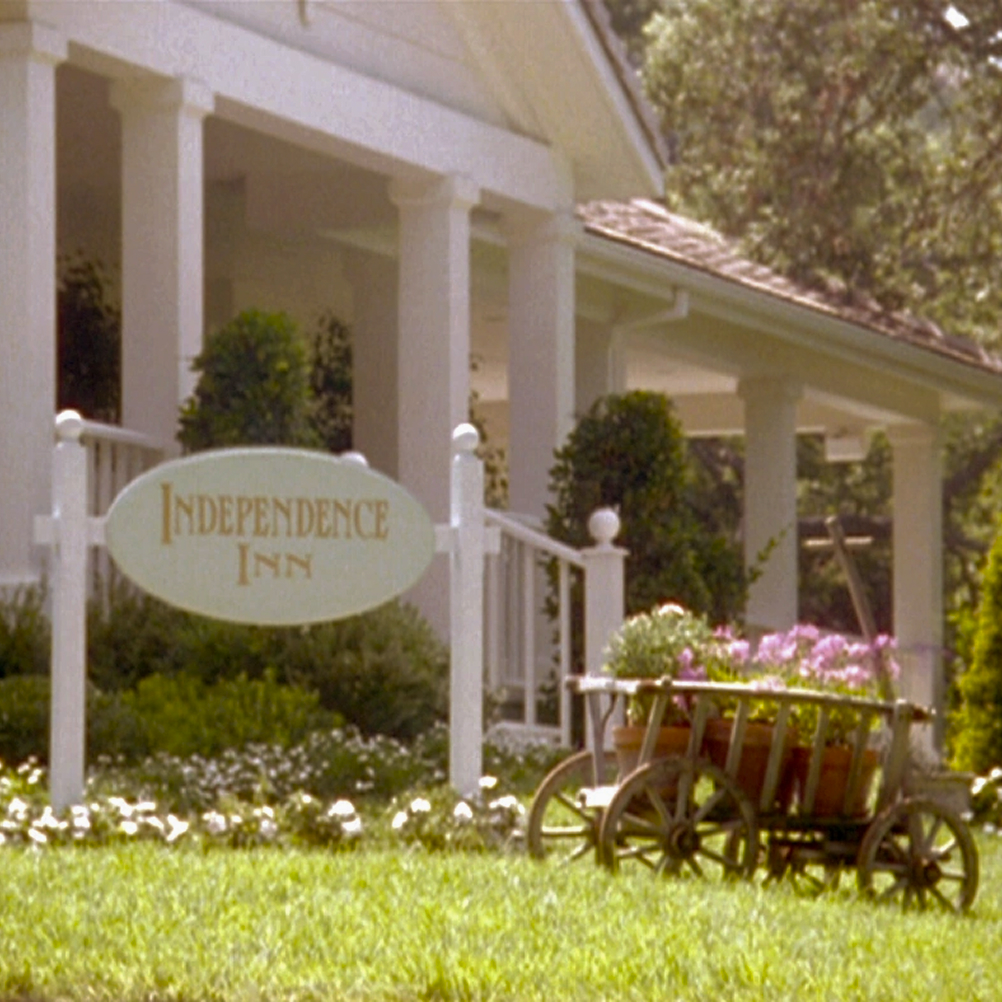 Independence Inn sign in front of a large house