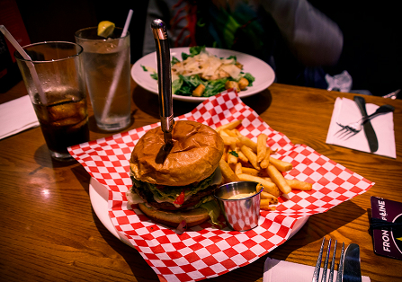 Burger with fries on the side