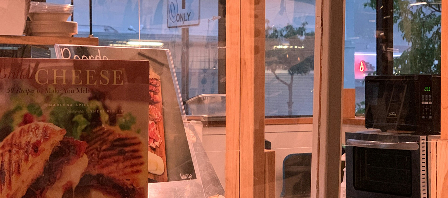 inside of a bakery looking out to the street